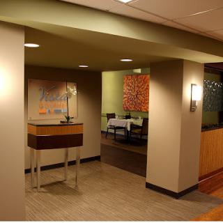A stylish and modern dining area entrance with ambient lighting.