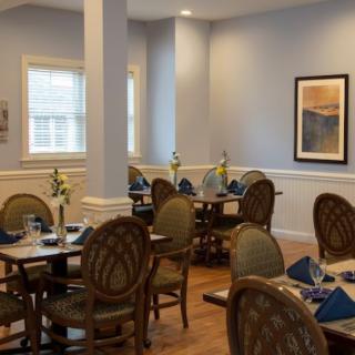 A cozy dining area with elegant furniture and soft lighting.