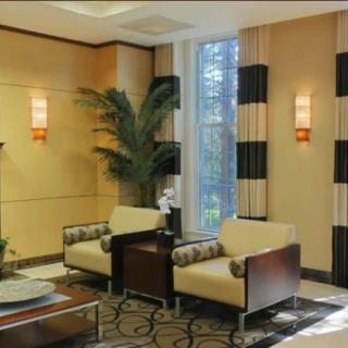 Modern lobby area with seating and elegant decor.