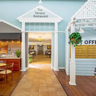 A welcoming restaurant entrance with adjacent post office interior.