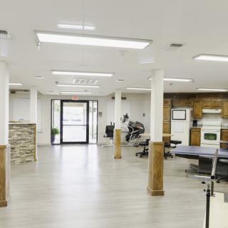 A modern gym interior with exercise equipment and open space.