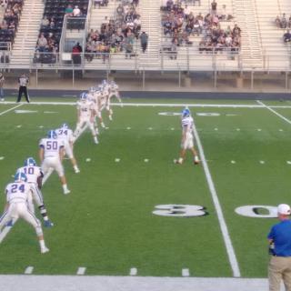 A football team prepares for a kickoff during a game.
