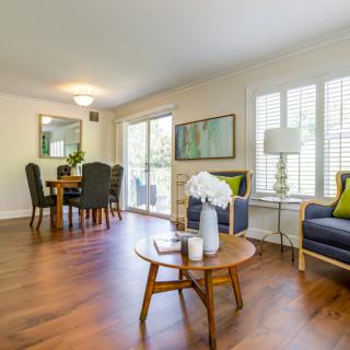 A spacious living and dining area with modern furnishings and ample natural light.