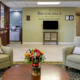 A welcoming lobby area with comfortable seating and floral decor.