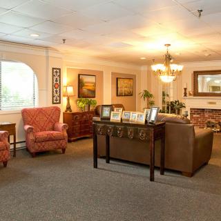 A cozy living room with comfortable seating and warm lighting.