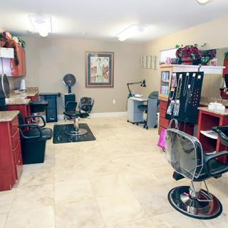 A well-equipped and organized hair salon interior with multiple styling stations.