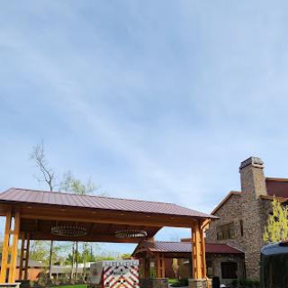 A beautiful building structure with wooden awning and a clear sky.