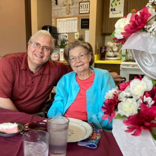 A heartwarming moment shared between family members during a meal.
