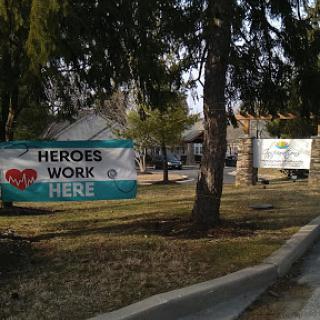 Banners displaying appreciation for local heroes in a community setting.