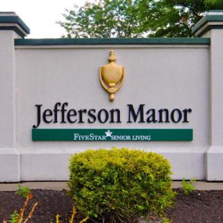 Entrance sign for Jefferson Manor, a senior living facility.