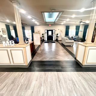 A beautifully designed modern lobby featuring elegant furniture and a spacious layout.