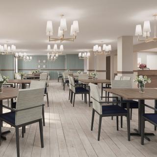 A modern and elegant dining area with neatly arranged tables and chairs.