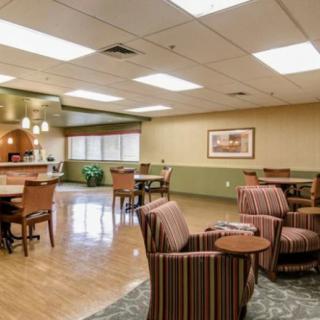 A spacious lounge area with comfortable seating and ample lighting.
