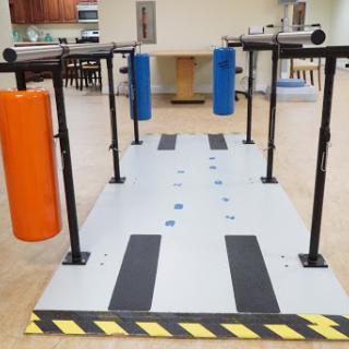 An obstacle course designed for balance training, featuring colored cylindrical elements.