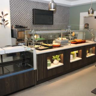 A stylish buffet setup in a modern kitchen, featuring organized food displays and contemporary design elements.