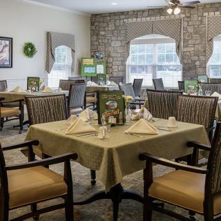 An elegant dining room with neatly arranged tables and chairs.
