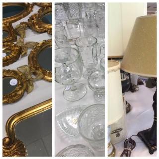 A collection of vintage decor items including mirrors, glassware, and lamps.