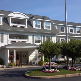 A large hotel with classic architecture and well-maintained landscaping.
