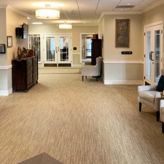 A spacious and elegantly decorated lobby with comfortable seating and warm lighting.