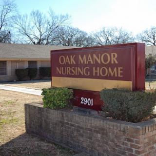 Signage for Oak Manor Nursing Home, indicating a facility dedicated to elderly care.