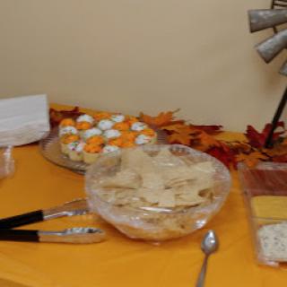 A festive table display featuring a variety of desserts, perfect for a Thanksgiving gathering.