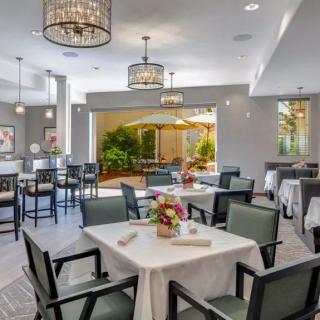 A modern dining area with elegant decor and well-arranged tables.