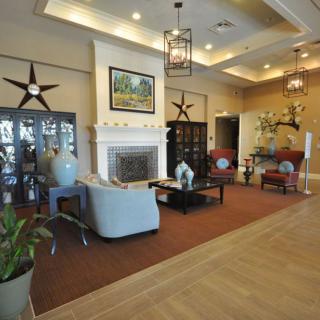 A stylish living room featuring a fireplace and comfortable seating area.