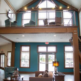 Spacious living room with a loft area and modern design elements.