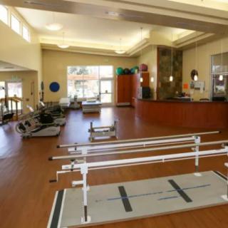 An indoor fitness and rehabilitation facility with various exercise equipment.