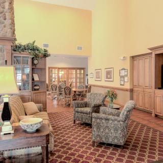 A cozy and inviting living room with comfortable seating and elegant decor.