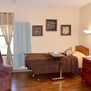 A cozy and functional bedroom, designed for comfort and care.