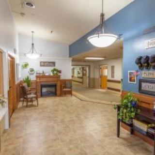 A well-decorated lobby area with seating and plants.