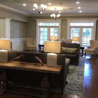 A cozy living room with elegant furniture and warm lighting.