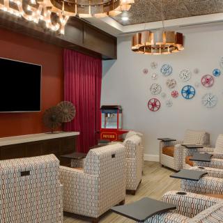 A cozy home theater with comfortable seating and modern decor.
