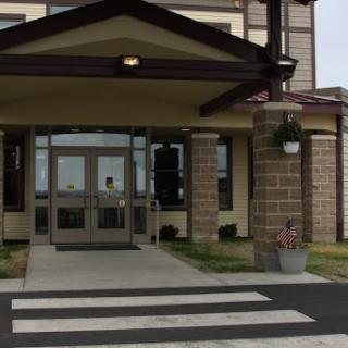 Main entrance of a building with a crosswalk.