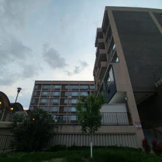 A view of modern buildings against a cloudy sky.