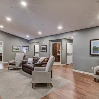 A modern living room with comfortable seating and elegant decor.