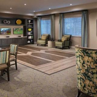 A cozy living room with elegant furniture and decor.