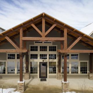 A modern wooden structure showcasing a welcoming entrance.