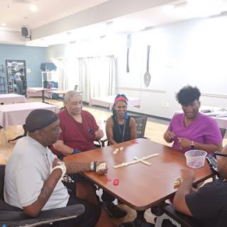 A group of individuals enjoying a game together in a bright and spacious indoor setting.