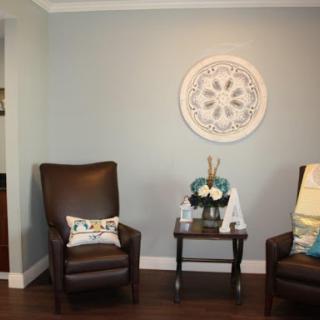 A cozy living room setup with two comfortable chairs and decorative accents.