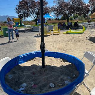 A vibrant playground scene featuring a sandbox, perfect for children to enjoy on a sunny day.