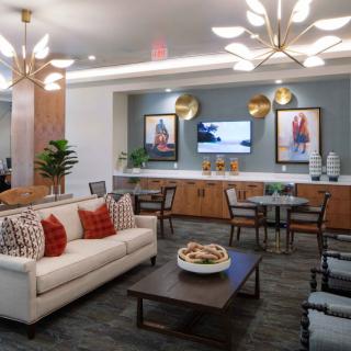 A modern living room with stylish furniture and elegant lighting.