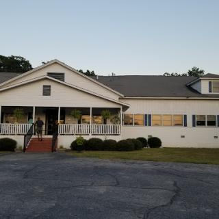 A peaceful evening view of a charming residential building.