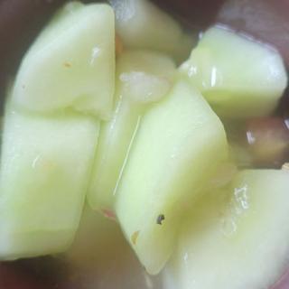 Sliced pieces of fresh fruit in preparation.