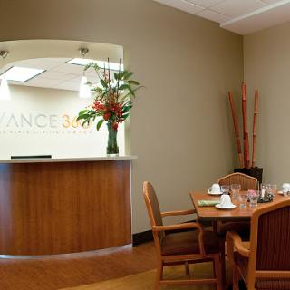 A welcoming reception area with modern decor and wooden furnishings.