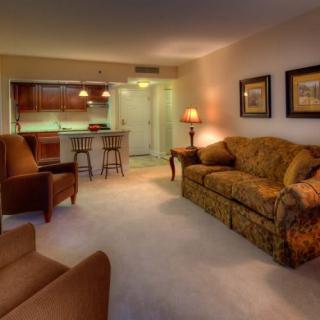 Cozy living room with comfortable seating and warm lighting.