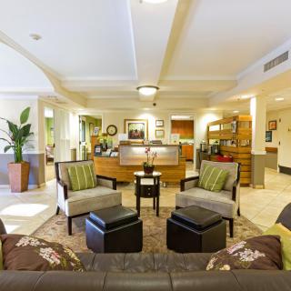 A well-decorated hotel lobby with comfortable seating and warm lighting.