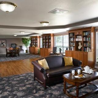 A cozy library area with comfortable seating and bookshelves, perfect for reading and relaxation.