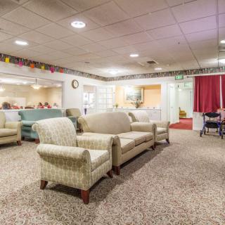 A cozy lounge area with comfortable seating and soft lighting.